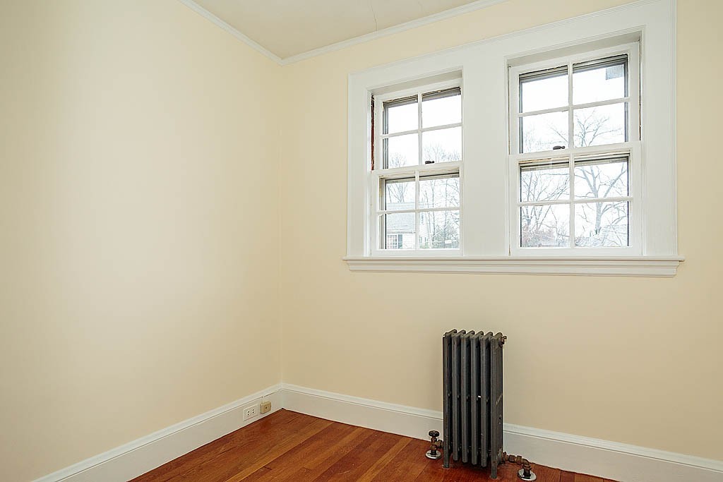 79 Douglas Road Belmont, MA 02478 - Photo 14 of 17 an empty room with wooden floor and windows