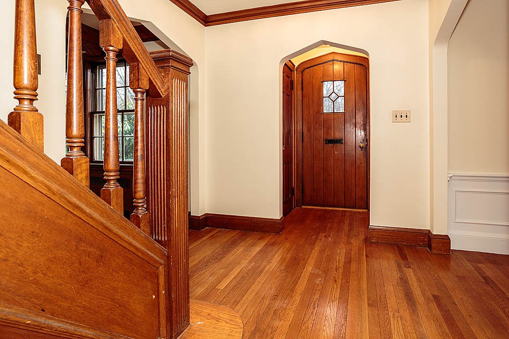 79 Douglas Road Belmont, MA 02478 - Photo 2 of 17 a view of a hallway with wooden floor and stairs