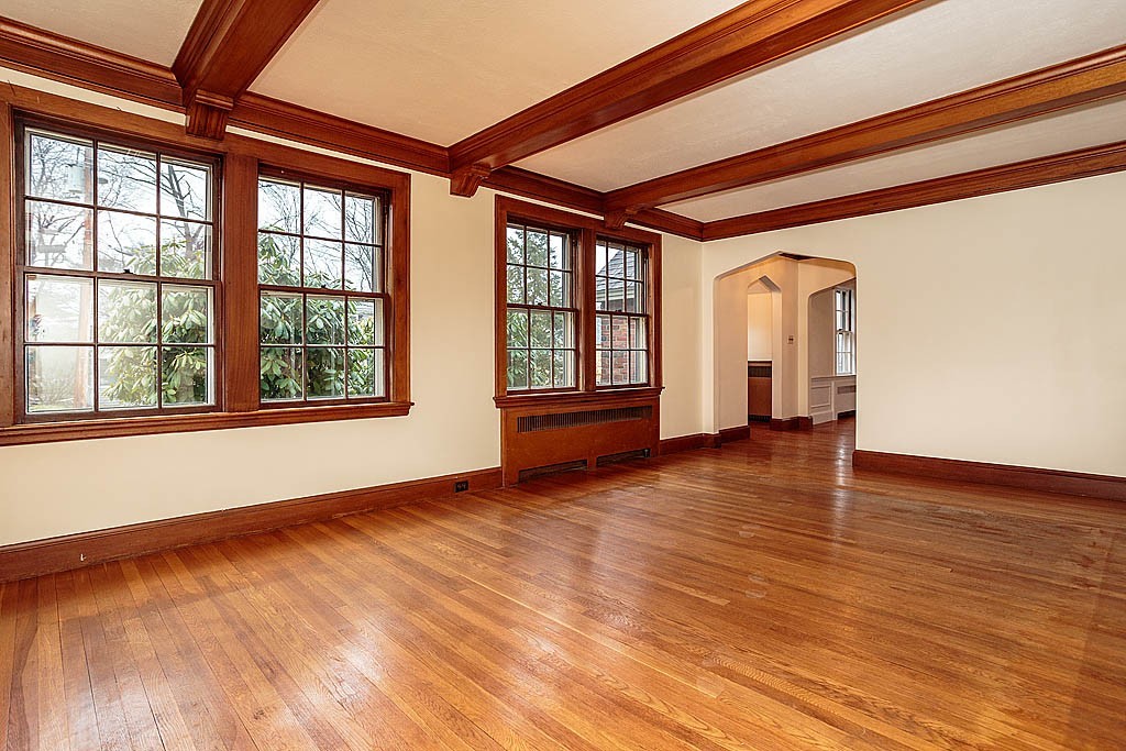 79 Douglas Road Belmont, MA 02478 - Photo 4 of 17 a view of an empty room with wooden floor and a window