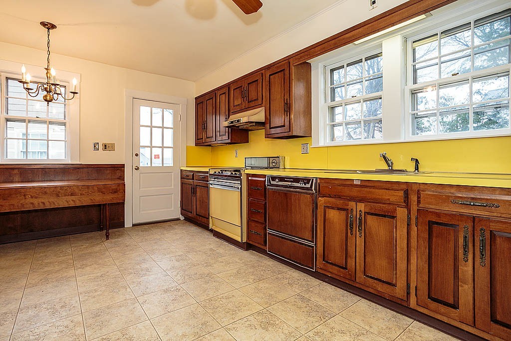 79 Douglas Road Belmont, MA 02478 - Photo 6 of 17 a kitchen with stainless steel appliances granite countertop a sink and cabinets