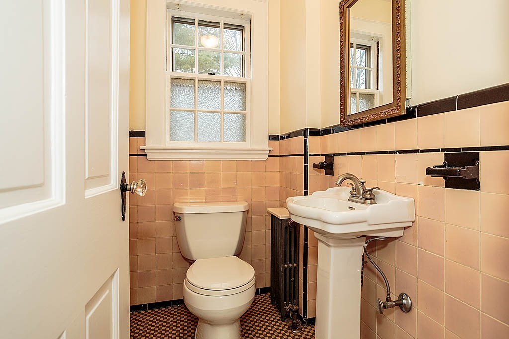 79 Douglas Road Belmont, MA 02478 - Photo 9 of 17 a bathroom with a sink toilet and a mirror