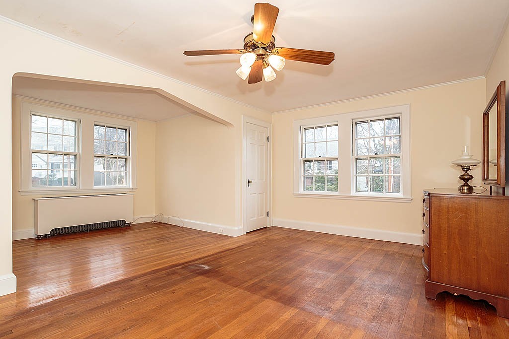 79 Douglas Road Belmont, MA 02478 - Photo 10 of 17 a view of an empty room with window and wooden floor