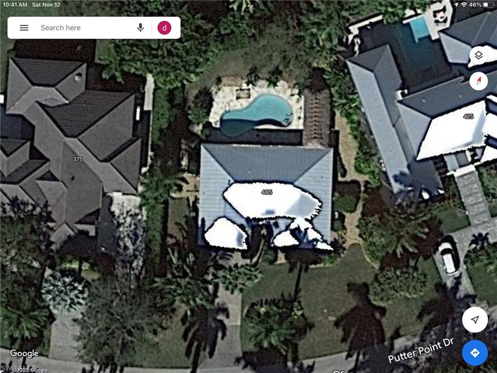 405 Putter Point Drive Naples, FL 34103 - Photo 2 of 3 an aerial view of a fireplace and table