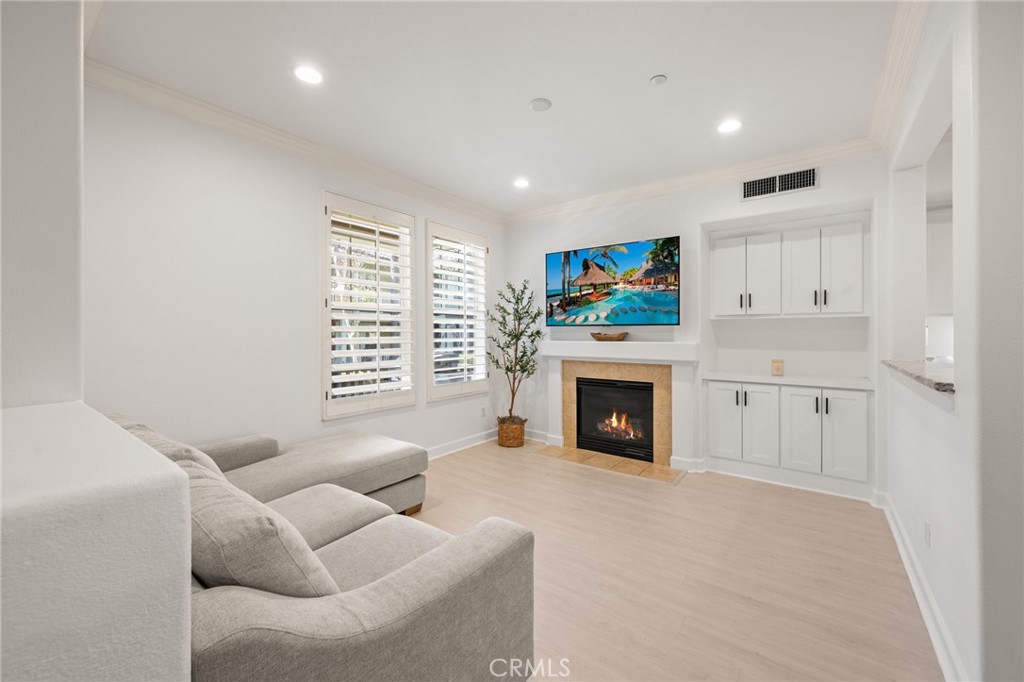 6 Lynde Street Ladera Ranch, CA 92694 - Photo 13 of 35 a living room with furniture a fireplace and a flat screen tv
