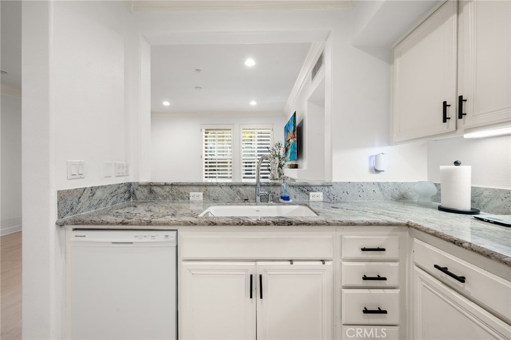6 Lynde Street Ladera Ranch, CA 92694 - Photo 22 of 35 a kitchen with granite countertop cabinets sink and window