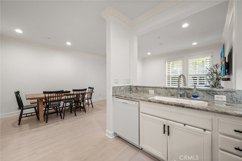 6 Lynde Street Ladera Ranch, CA 92694 - Photo 23 of 35 a kitchen with center island table and chairs