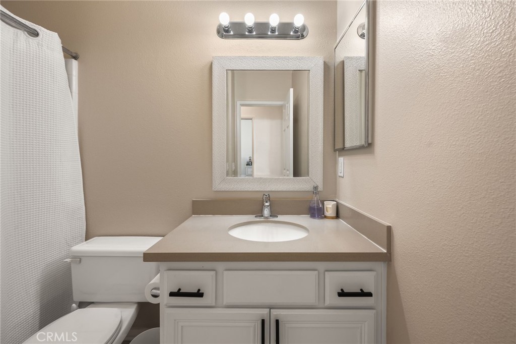 6 Lynde Street Ladera Ranch, CA 92694 - Photo 30 of 35 a bathroom with a sink toilet and mirror