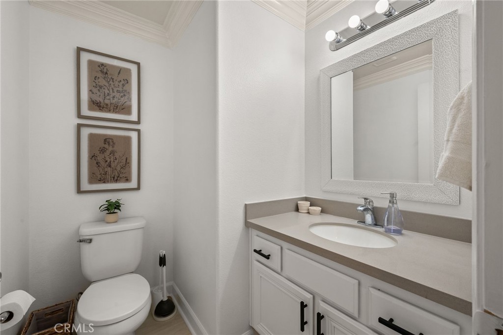 6 Lynde Street Ladera Ranch, CA 92694 - Photo 32 of 35 a bathroom with a toilet a sink and mirror