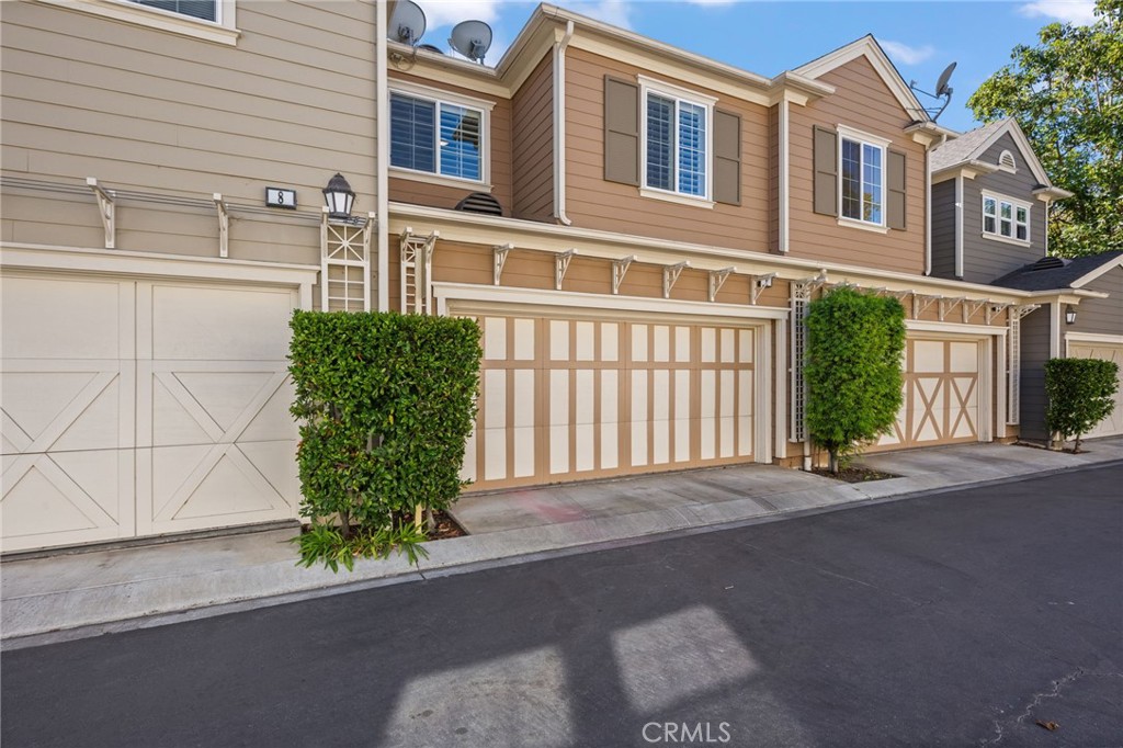 6 Lynde Street Ladera Ranch, CA 92694 - Photo 34 of 35 a front view of a house with a yard and garage