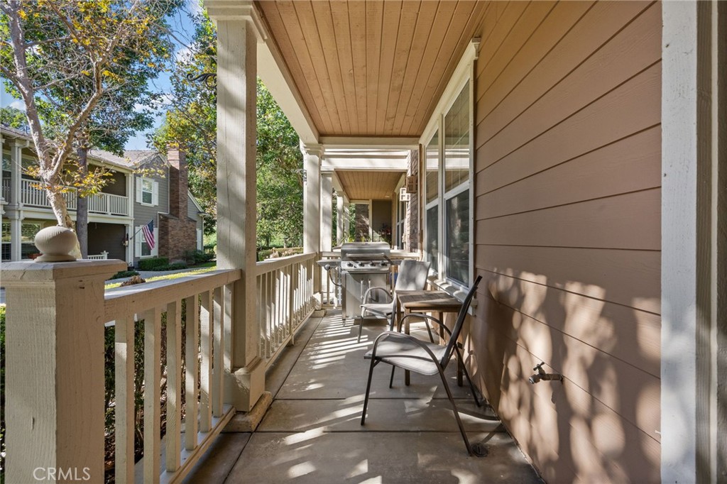 6 Lynde Street Ladera Ranch, CA 92694 - Photo 4 of 35 a view of a patio with table and chairs and wooden floor