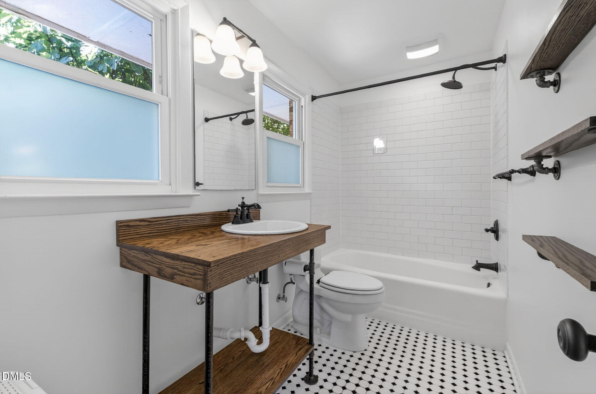 1224 Pineview Drive Raleigh, NC 27606 - Photo 21 of 45 a bathroom with a sink a toilet a mirror and shower