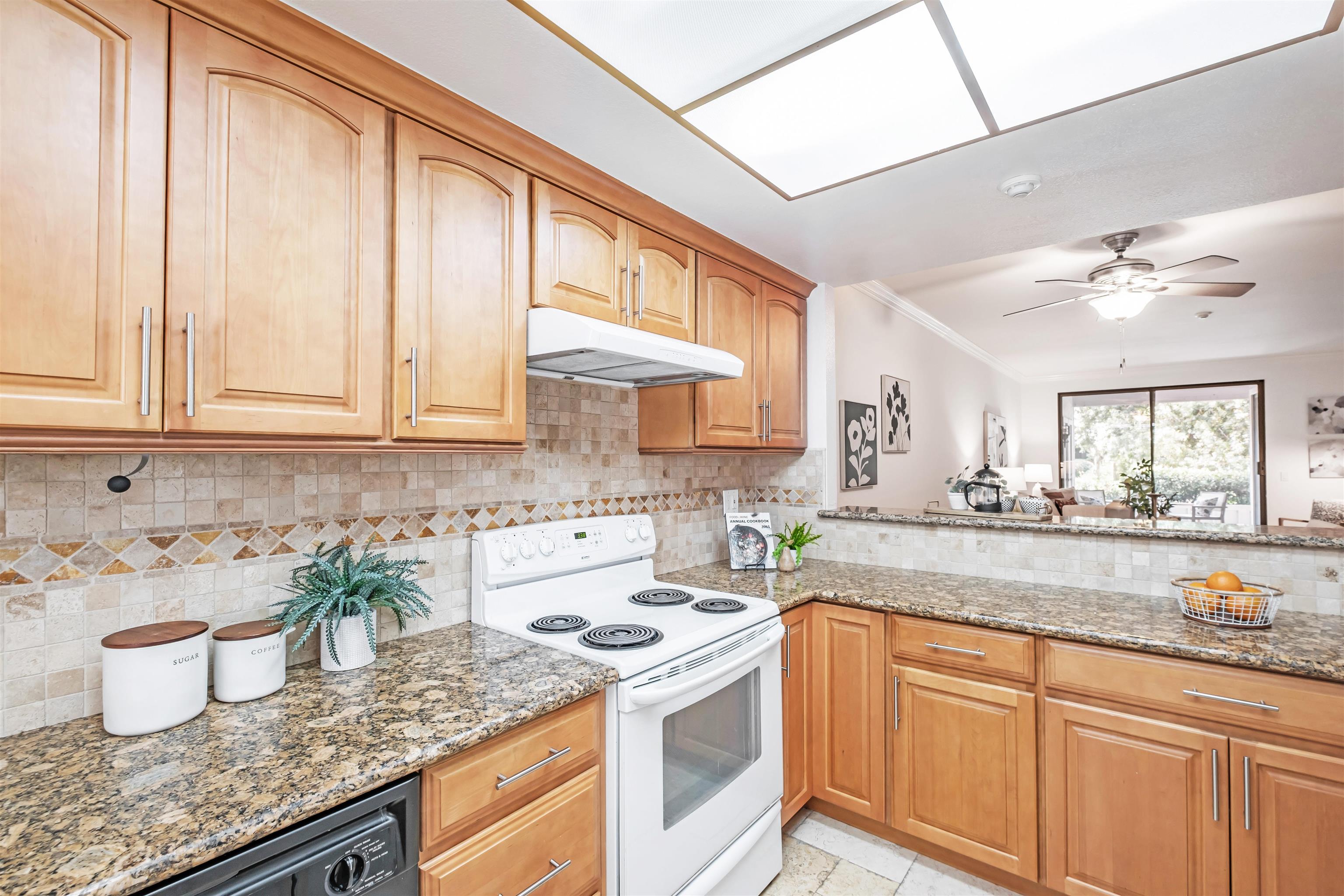 39945 Parada Street, Unit A Newark, CA 94560 - Photo 15 of 44 a kitchen with stainless steel appliances granite countertop a sink stove and cabinets