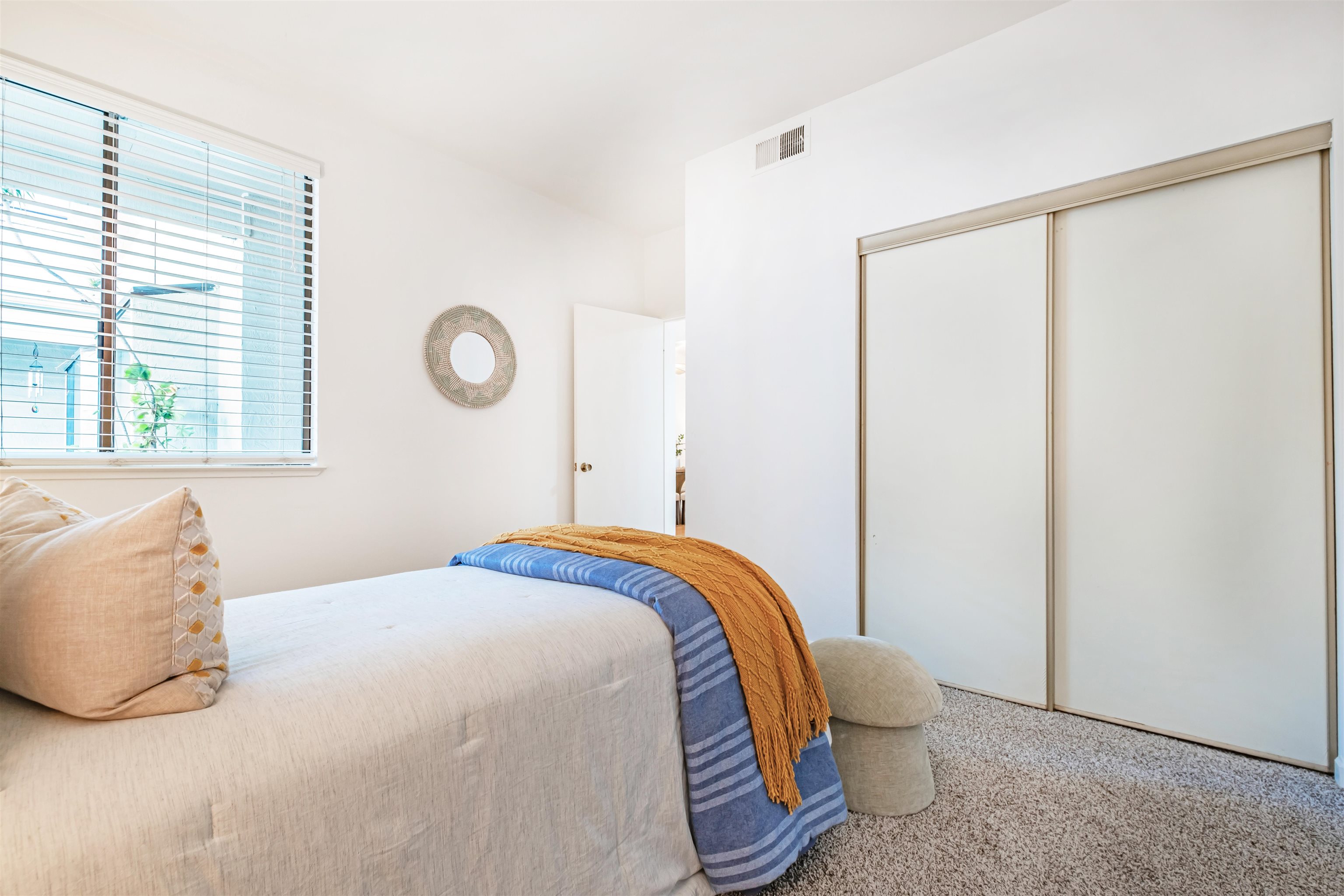 39945 Parada Street, Unit A Newark, CA 94560 - Photo 27 of 44 a bedroom with a bed and a window