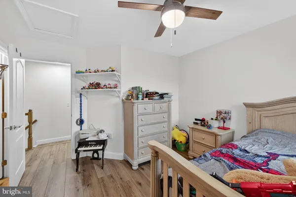 a spacious bedroom with a bed and a fireplace