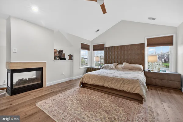 a bedroom with a large bed and a window