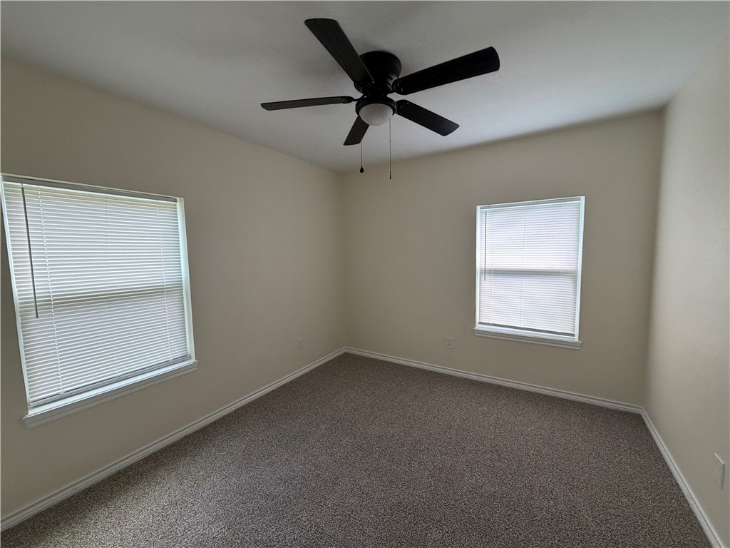 306 West 23rd Street Bryan, TX 77803 - Photo 7 of 12 an empty room with a window