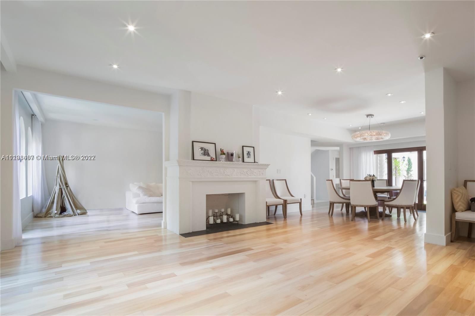 5768 Pine Tree Drive Miami Beach, FL 33140 - Photo 3 of 17 a living room with furniture and a fireplace