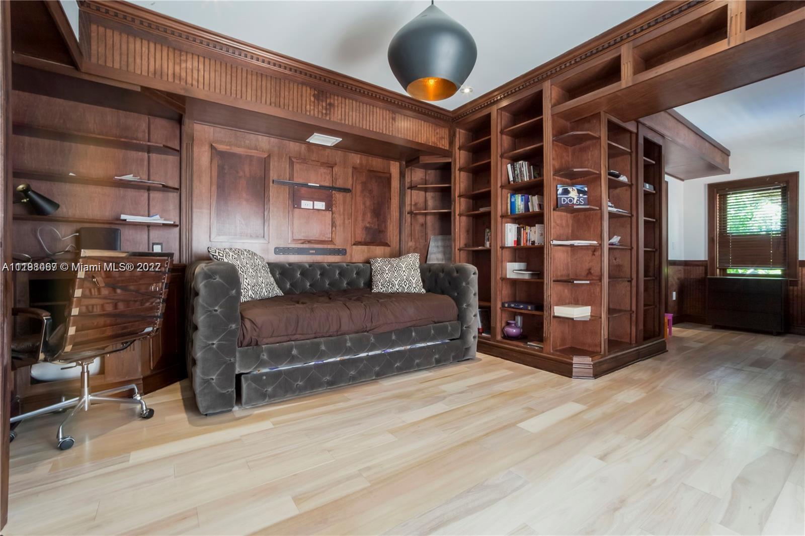 5768 Pine Tree Drive Miami Beach, FL 33140 - Photo 8 of 17 a view of an empty room with wooden floor