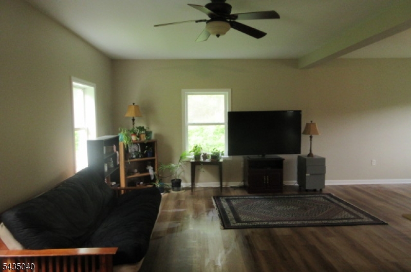 28 Beaver Run Road Lafayette, NJ 07848 - Photo 33 of 36 a living room with furniture and a flat screen tv