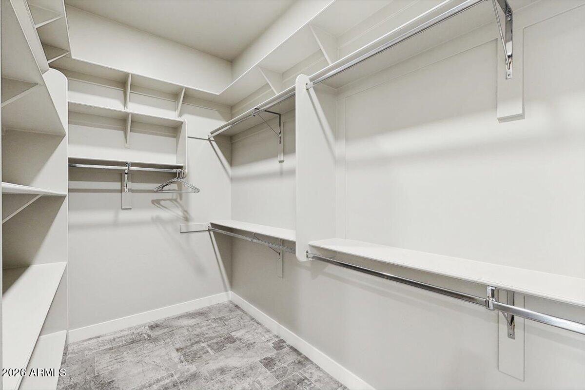 2645 East Osborn Road, Unit 3 Phoenix, AZ 85016 - Photo 9 of 14 a view of walk in closet with empty racks