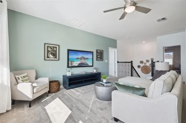 a living room with furniture and a view of couch