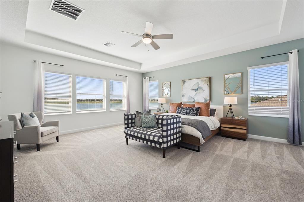 3012 Ella Way St. Cloud, FL 34771 - Photo 15 of 56 a spacious bedroom with a bed and a large window