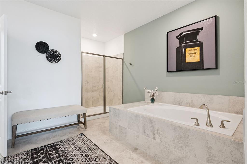 3012 Ella Way St. Cloud, FL 34771 - Photo 20 of 56 a bathroom with a bathtub and a shower