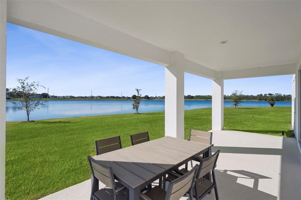 3012 Ella Way St. Cloud, FL 34771 - Photo 2 of 56 a view of a big room with a table and chairs