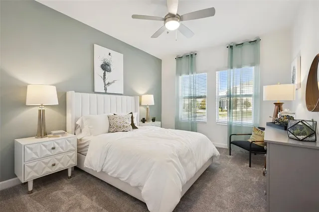 a bathroom with a granite countertop toilet a sink and a mirror