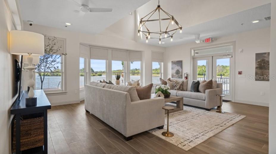 3012 Ella Way St. Cloud, FL 34771 - Photo 41 of 56 a living room with furniture and a chandelier