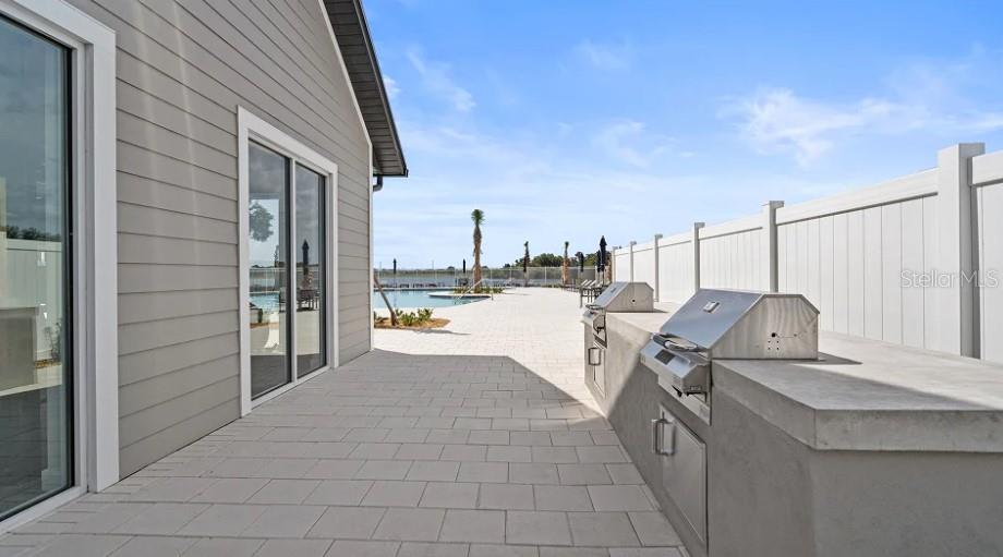 3012 Ella Way St. Cloud, FL 34771 - Photo 44 of 56 a terrace with outdoor seating and city view