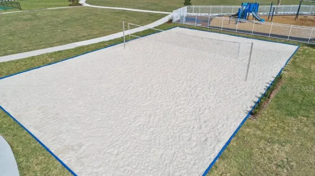 a front view of a house with a yard table and chairs