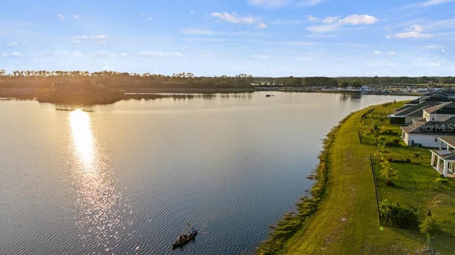 3012 Ella Way St. Cloud, FL 34771 - Photo 50 of 56 a view of a lake with a mountain