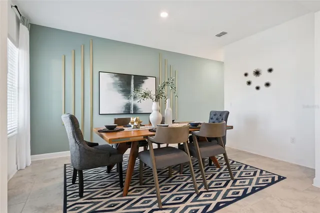a view of a dining room with furniture
