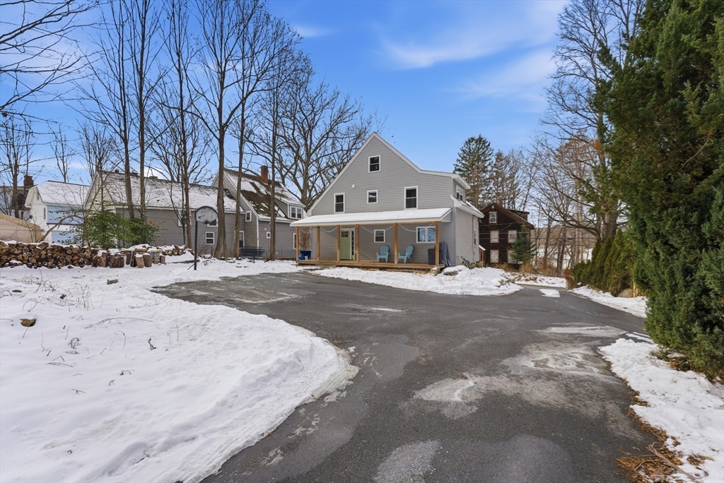 160 Cottage Street Athol, MA 01331 - Photo 30 of 35 a front view of a house with a yard and garage