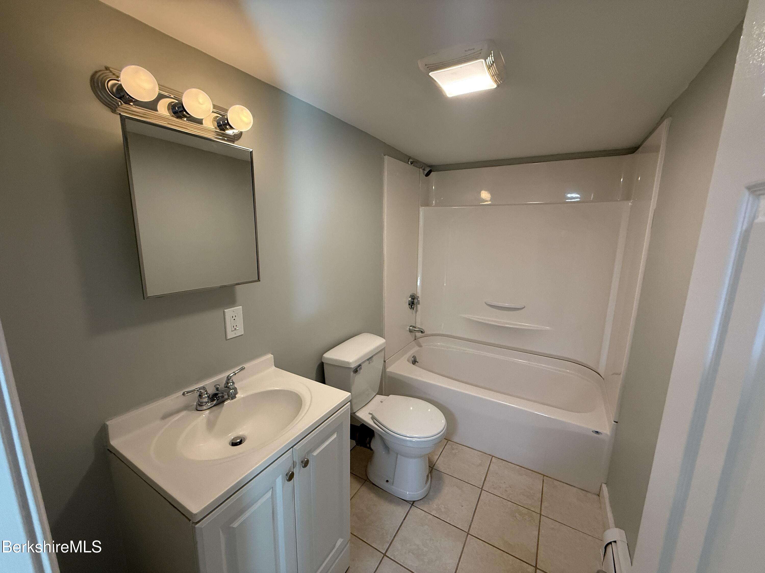 17 Elm Street, Unit A Adams, MA 01220 - Photo 11 of 17 a bathroom with a sink toilet and shower
