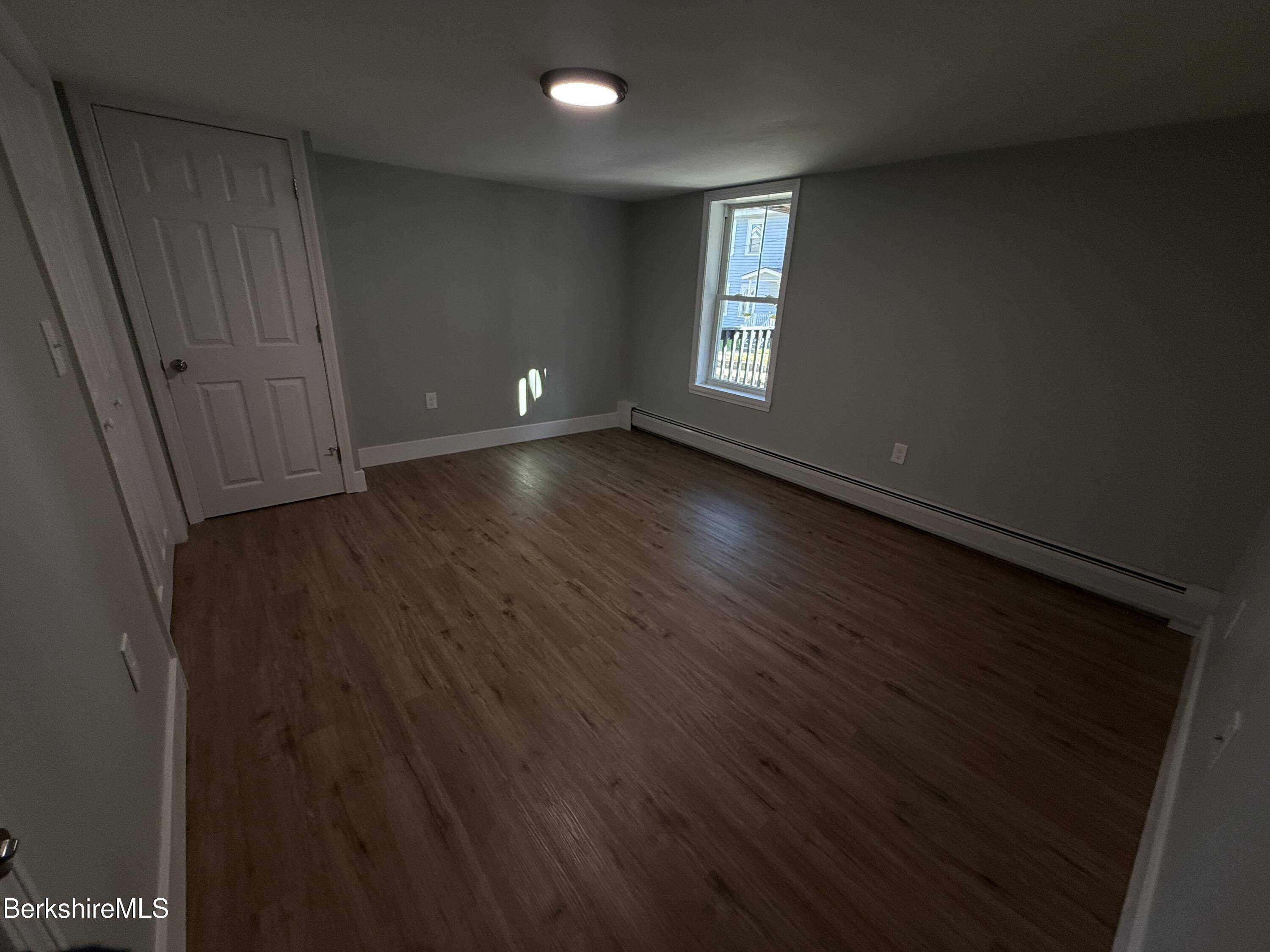 17 Elm Street, Unit A Adams, MA 01220 - Photo 14 of 17 a view of a livingroom with wooden floor and window
