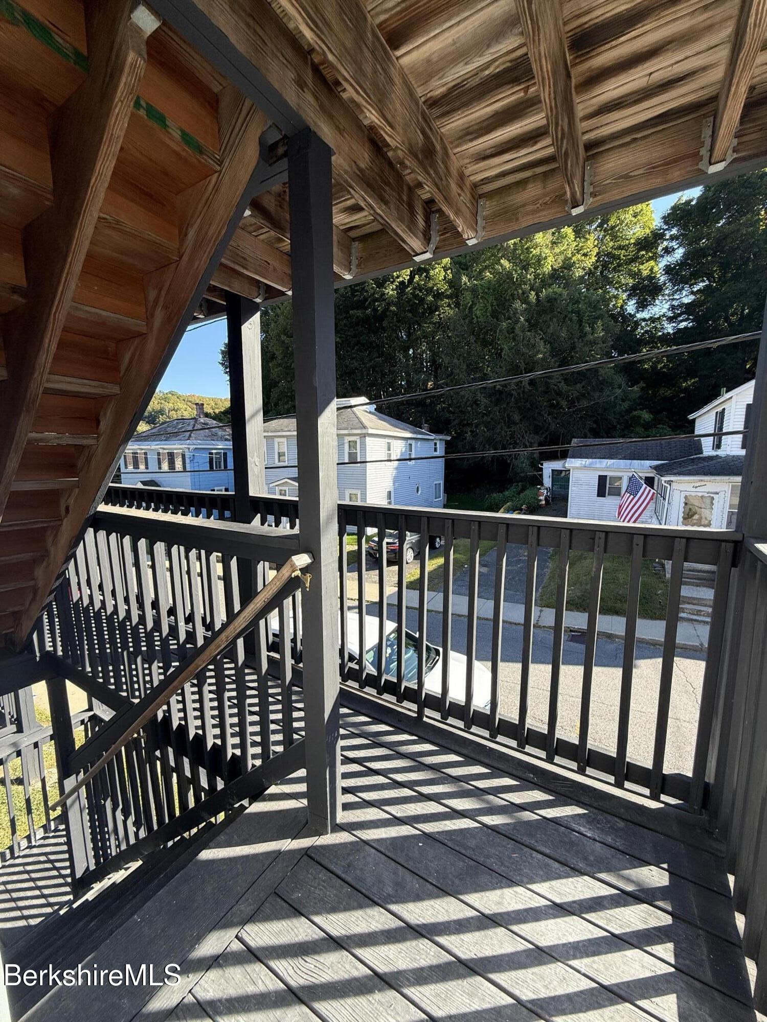 17 Elm Street, Unit A Adams, MA 01220 - Photo 16 of 17 a view of balcony with wooden floor