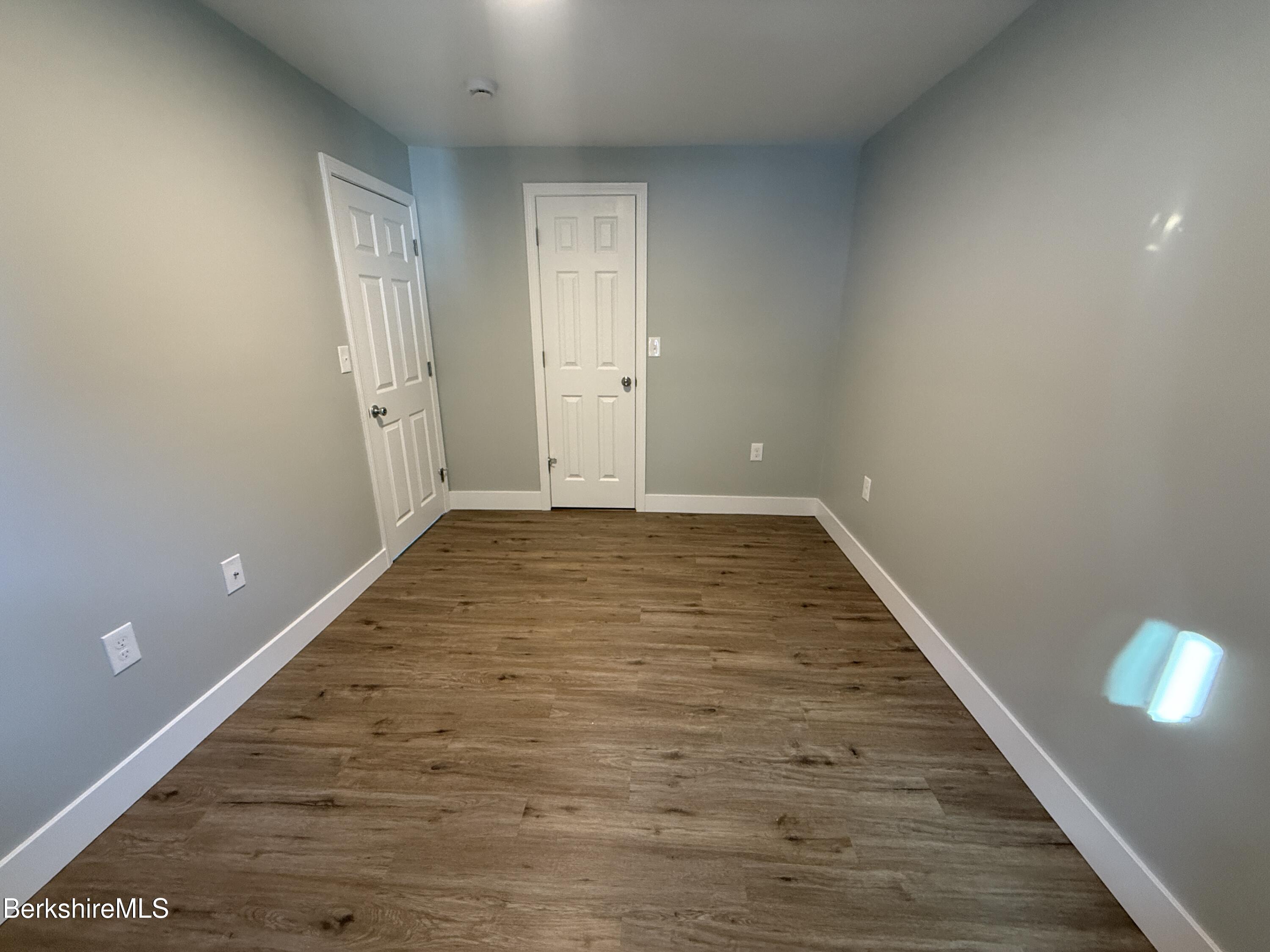 17 Elm Street, Unit A Adams, MA 01220 - Photo 2 of 17 wooden floor in an empty room with a window