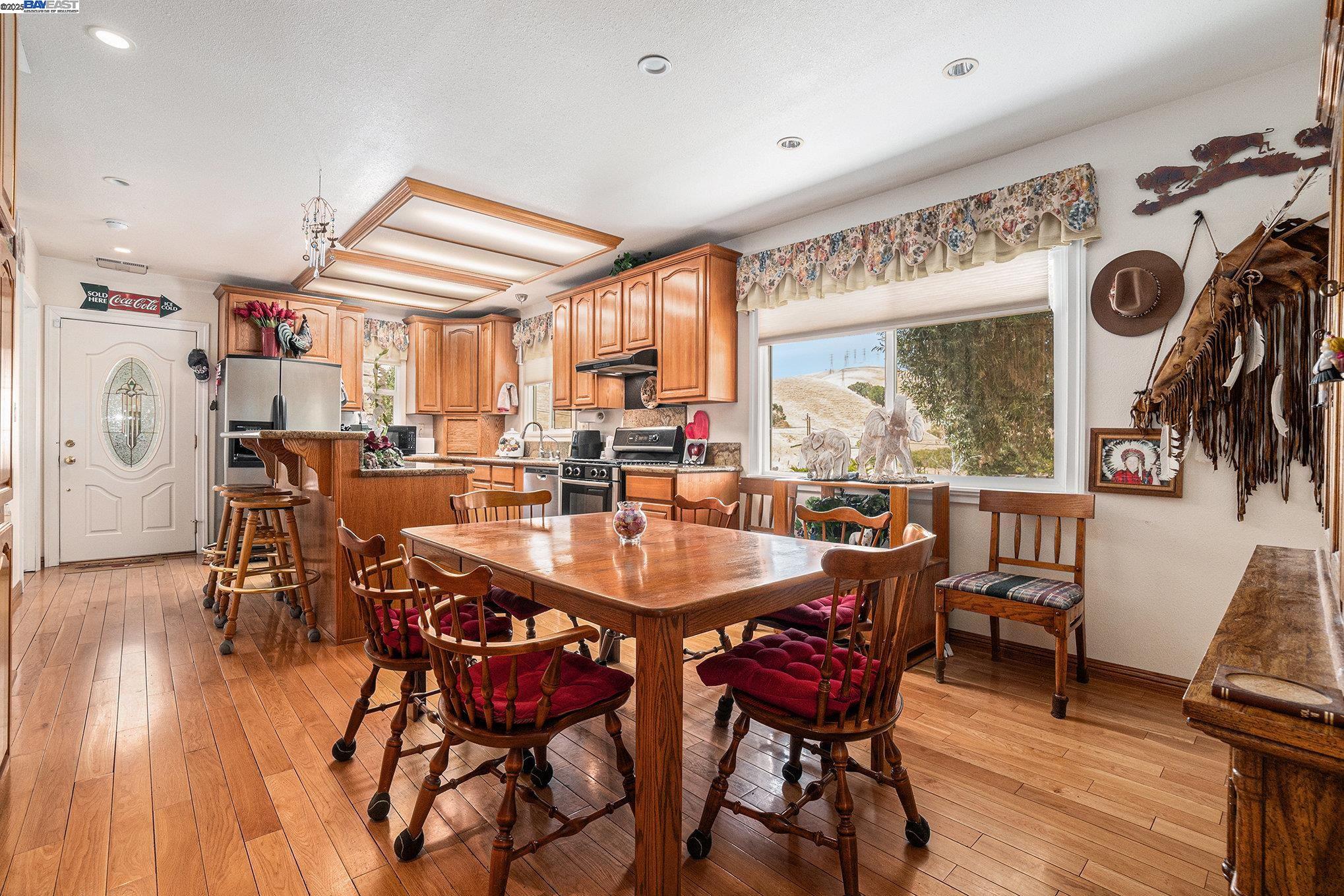 5799 Nortonville Road Pittsburg, CA 94565 - Photo 17 of 59 a dining room with furniture window and wooden floor