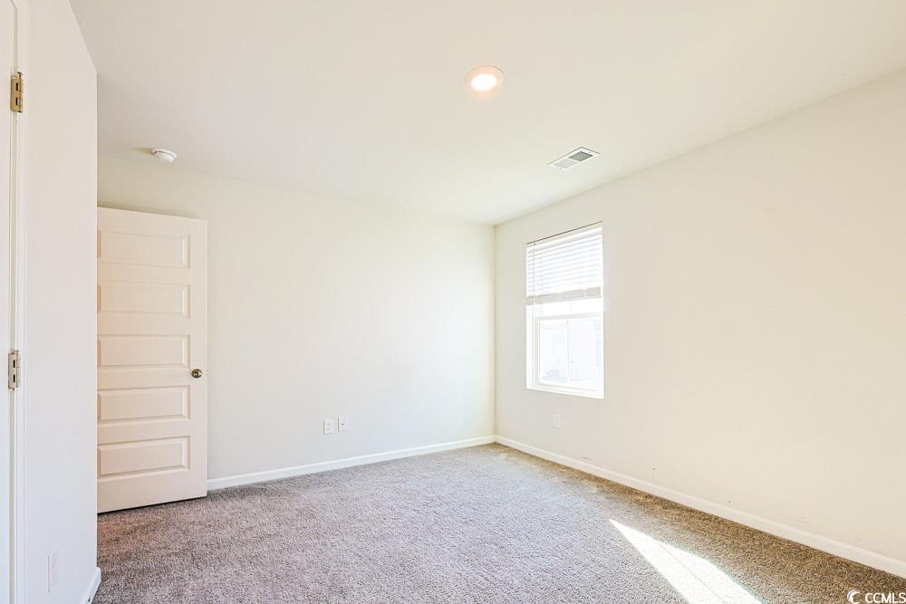 1560 Swing Bridge Way Myrtle Beach, SC 29588 - Photo 25 of 35 Unfurnished room featuring light carpet and recessed lighting