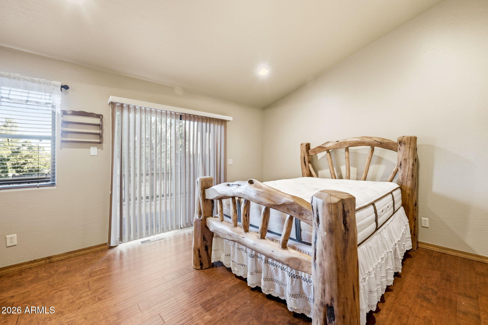 2750 Columbia Lane Overgaard, AZ 85933 - Photo 21 of 51 a bedroom with a bed and a large window
