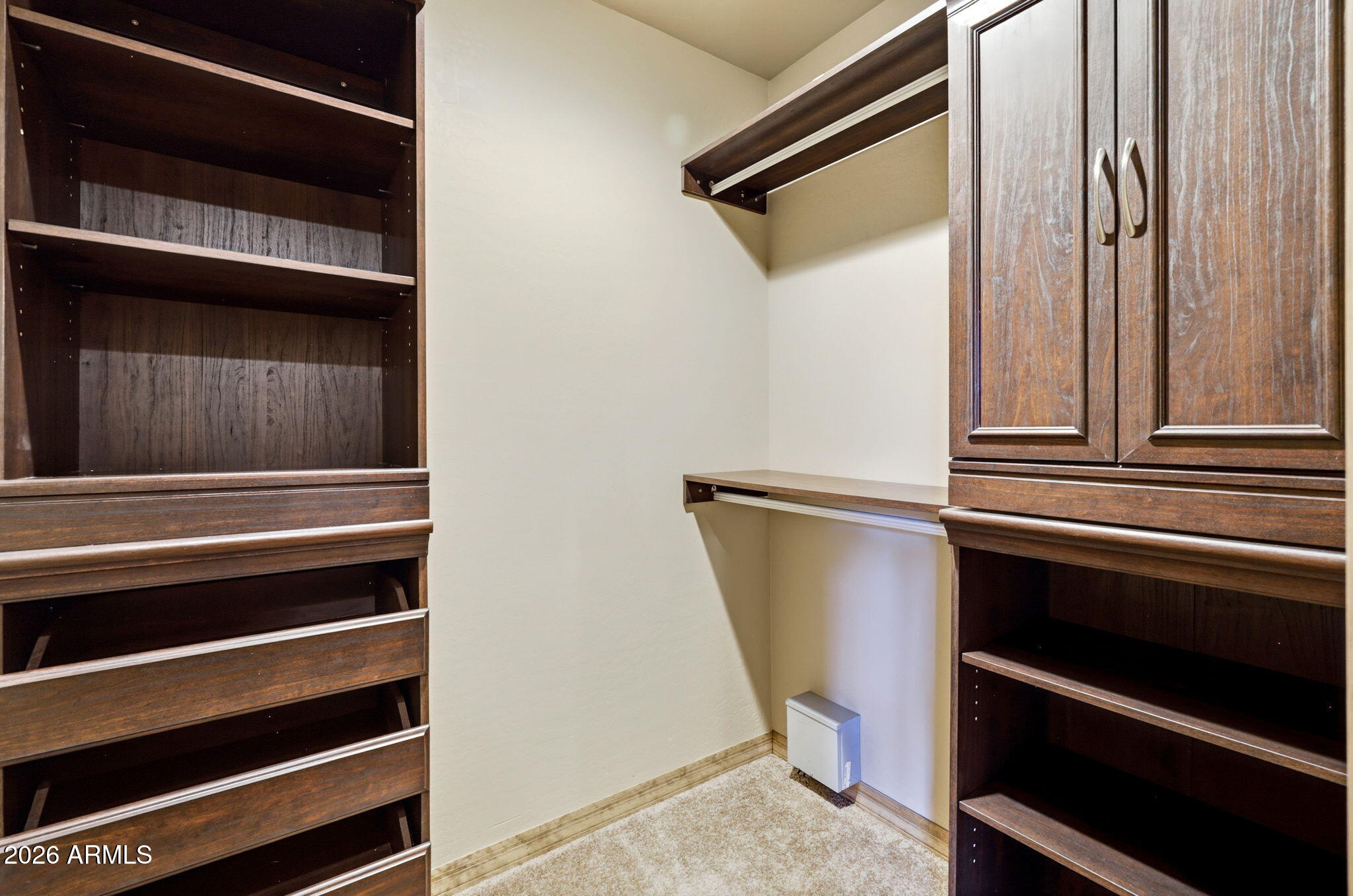 2750 Columbia Lane Overgaard, AZ 85933 - Photo 26 of 51 a view of walk in closet with empty racks