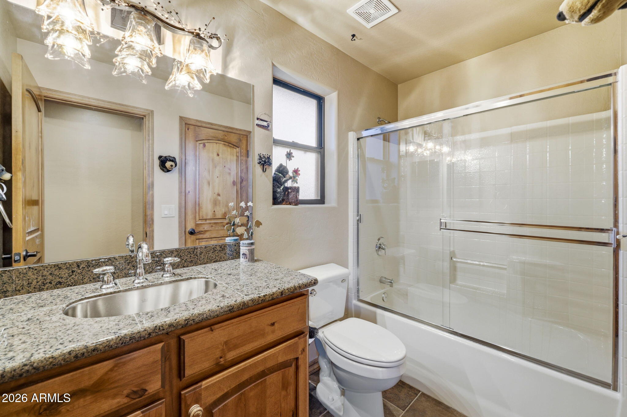 2750 Columbia Lane Overgaard, AZ 85933 - Photo 27 of 51 a bathroom with a granite countertop sink toilet and shower