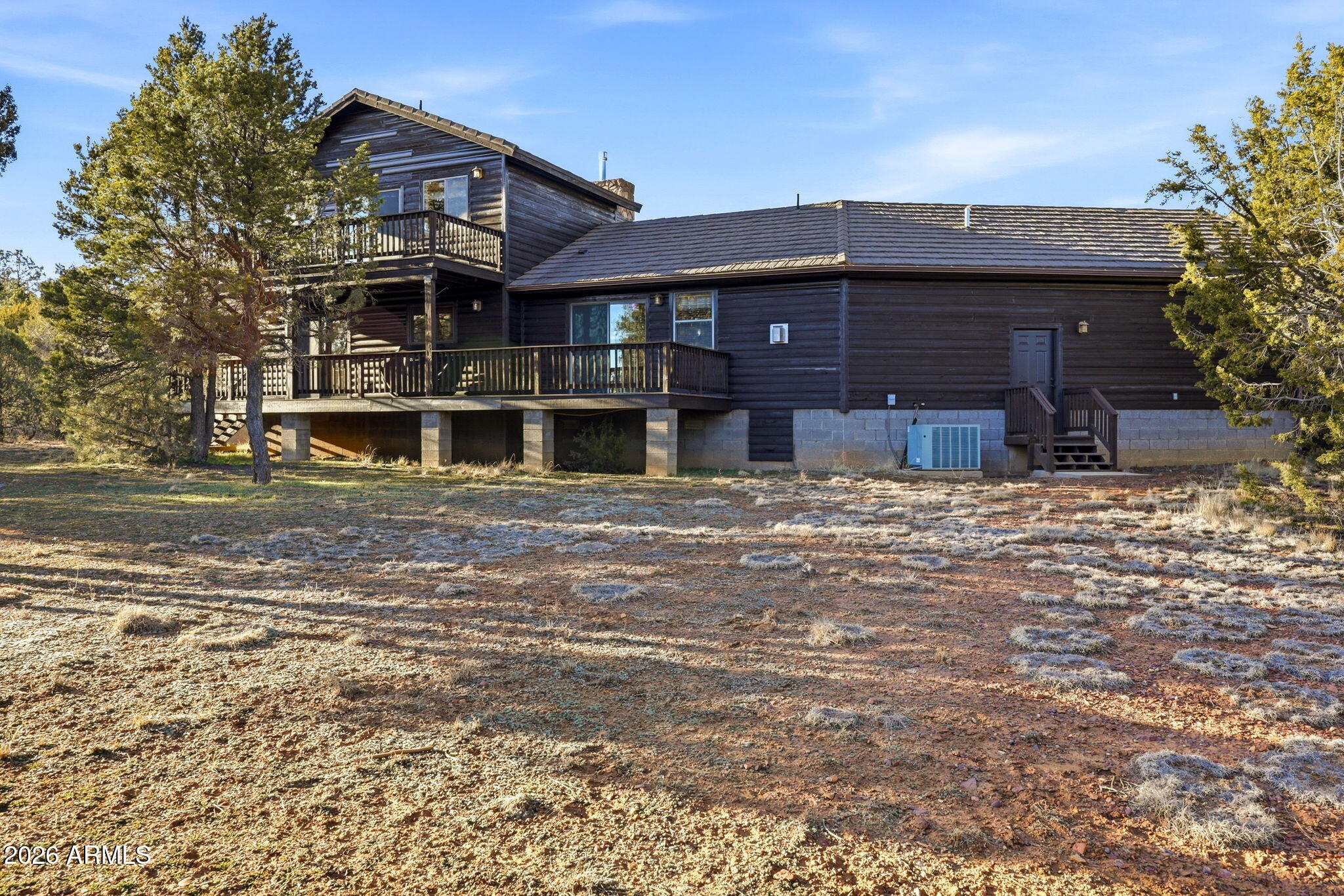 2750 Columbia Lane Overgaard, AZ 85933 - Photo 37 of 51 a view of a house with a large window and a yard