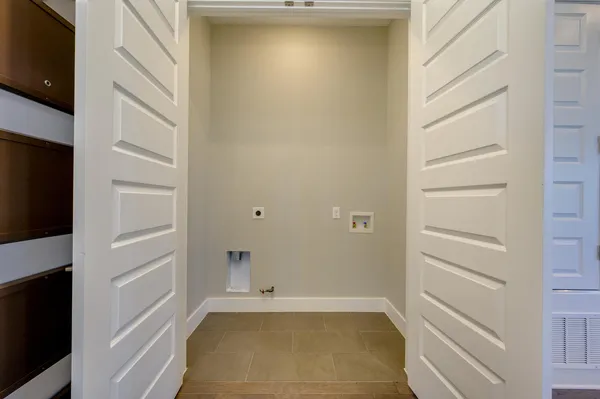 a bathroom with a shower and a glass door