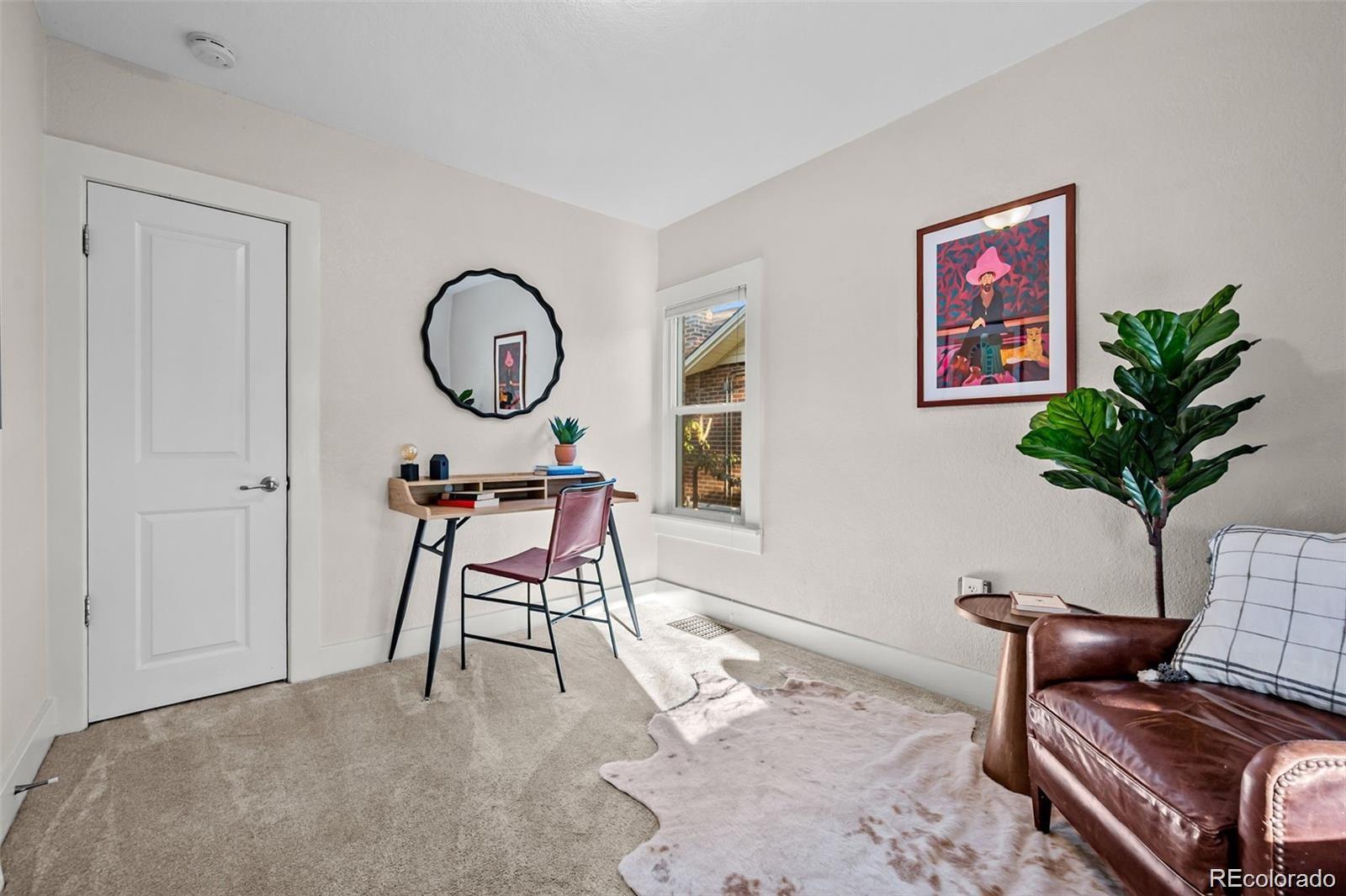 3649 Garfield Street Denver, CO 80205 - Photo 15 of 30 a work room with furniture a potted plant and a potted plant