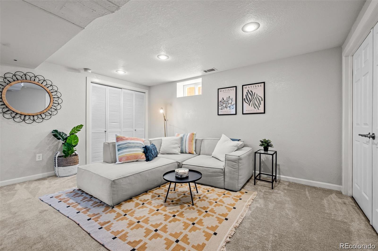 3649 Garfield Street Denver, CO 80205 - Photo 16 of 30 a living room with furniture and a window
