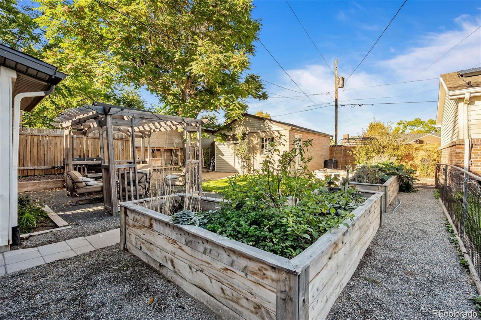 3649 Garfield Street Denver, CO 80205 - Photo 25 of 30 a view of a pathway with a wooden fence