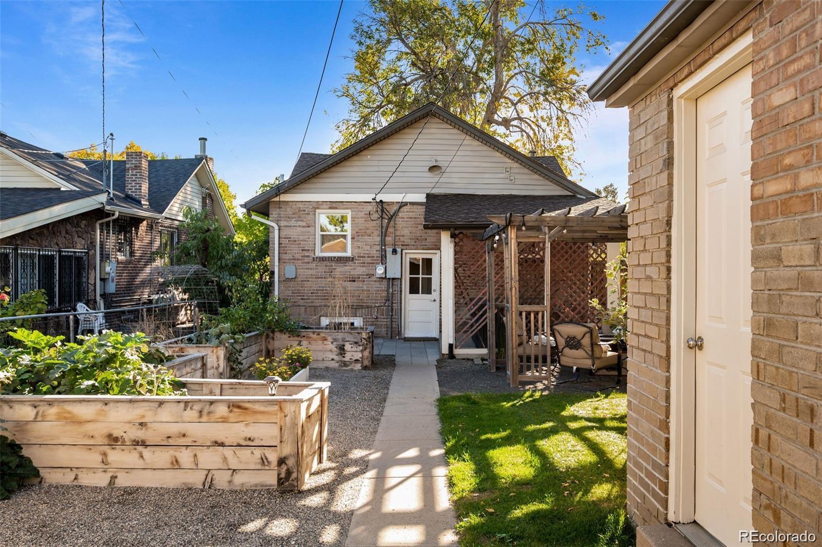 3649 Garfield Street Denver, CO 80205 - Photo 26 of 30 a view of house with yard outdoor seating and entertaining space